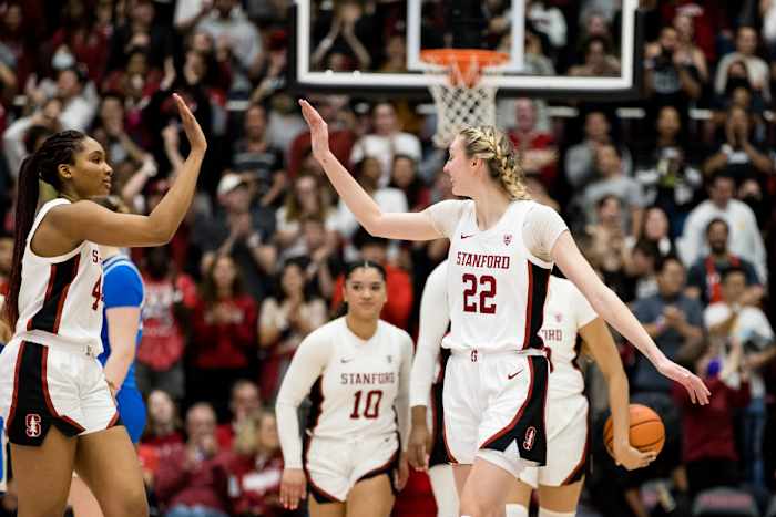 Feb 20, 2023; Stanford, California, USA; Stanford Cardinal forward Cameron Brink (22) and forward Kiki Iriafen (44) celebrate their 71-66 victory over UCLA Bruins at Maples Pavilion. Mandatory Credit: John Hefti-USA TODAY Sports